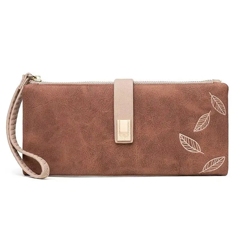 Nina – Portefeuille fin zippé motif feuilles en relief