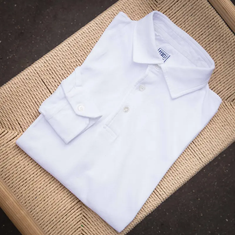 Polo manches longues piqué de coton blanc
